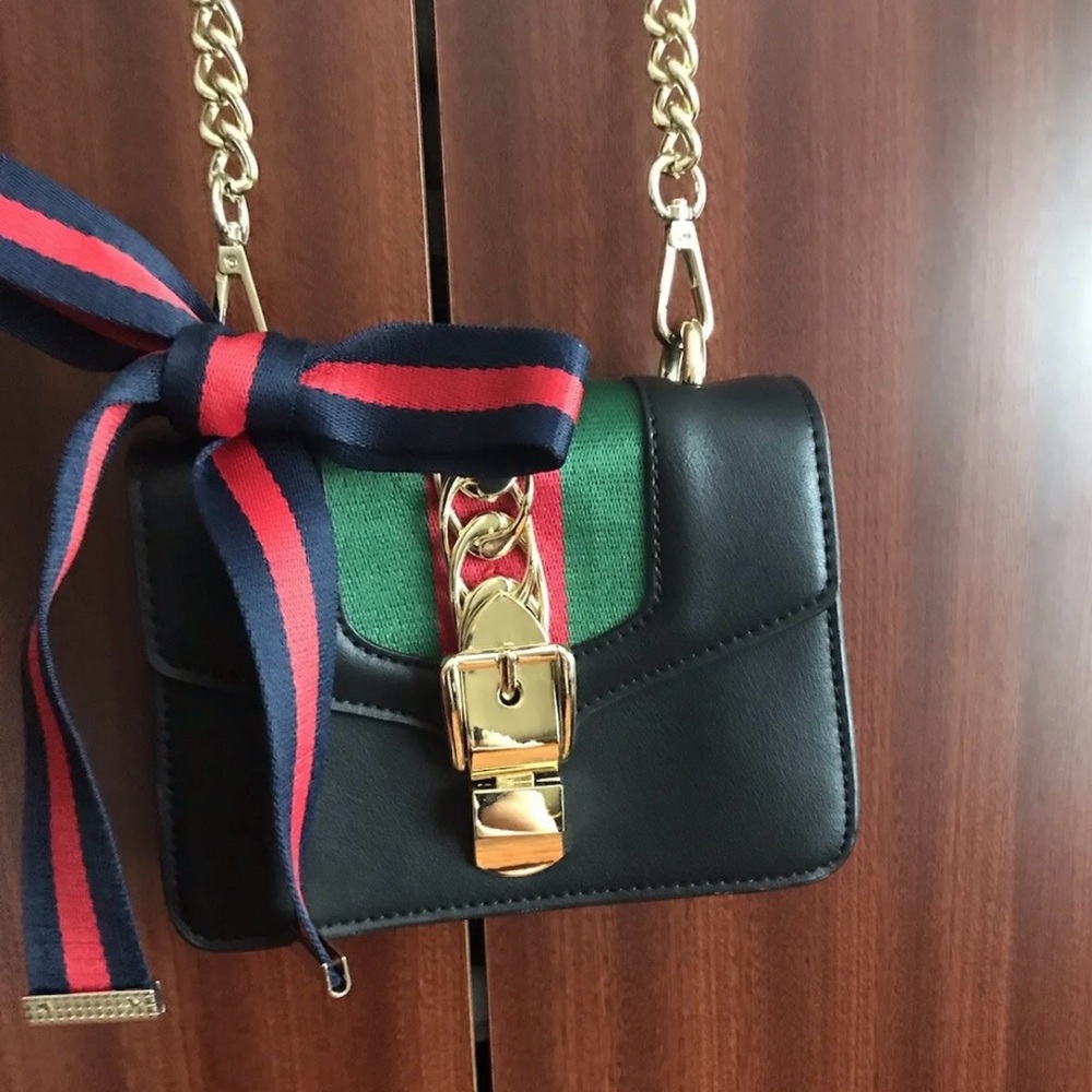 New Beautiful Small Shoulder Bag with a bright bow.  Size7 1/4”/ 5 1/4”
